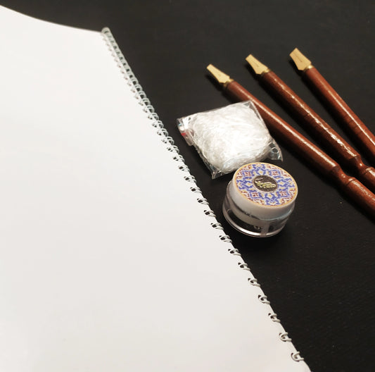 bamboo pen writing calligraphy using silk likka in inkwell